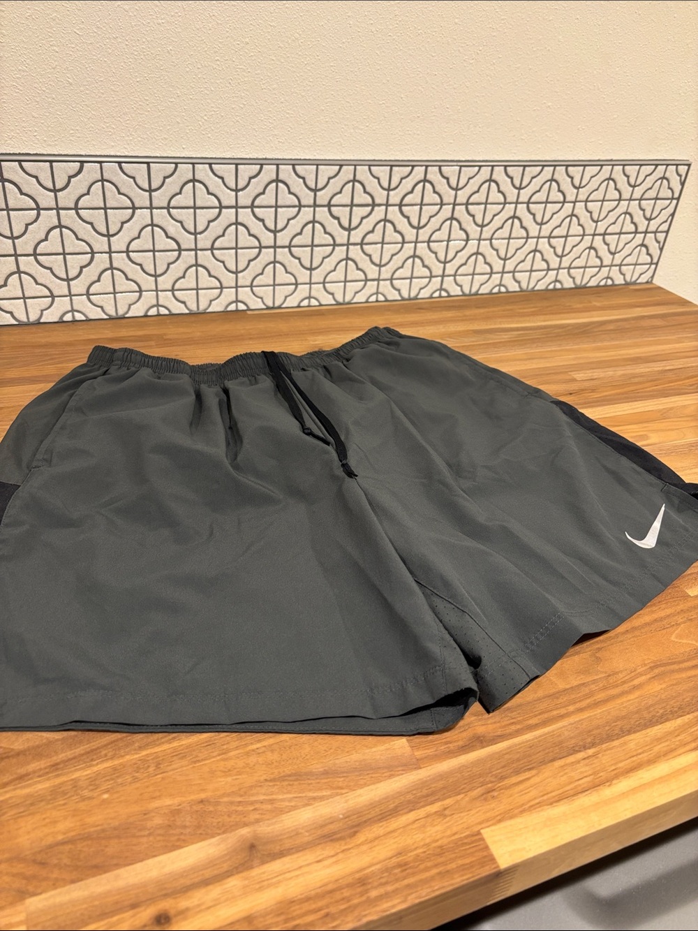 Nike Dark Gray Running Shorts with White Swoosh